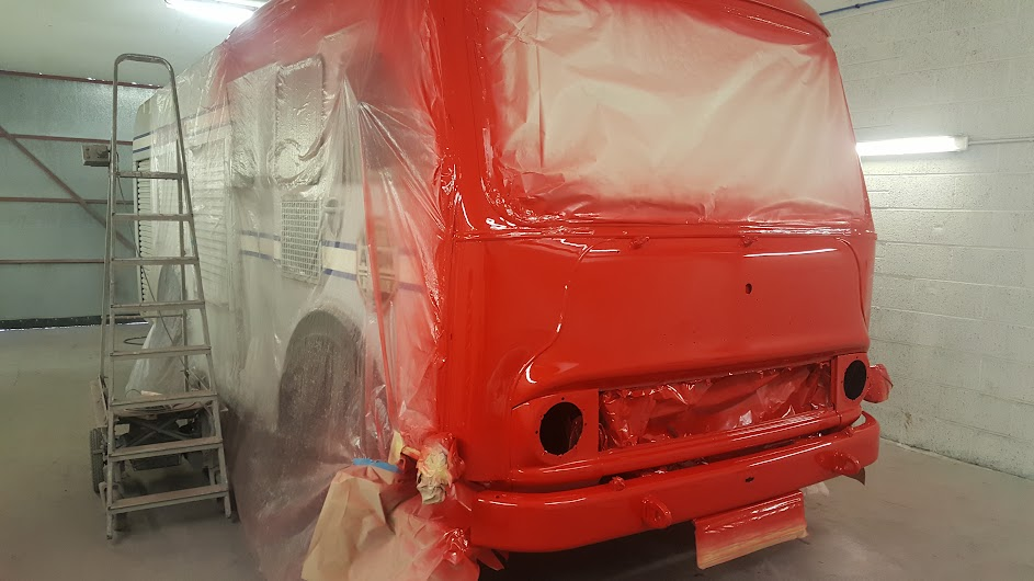 Motorhome cab masked up and resprayed bright red