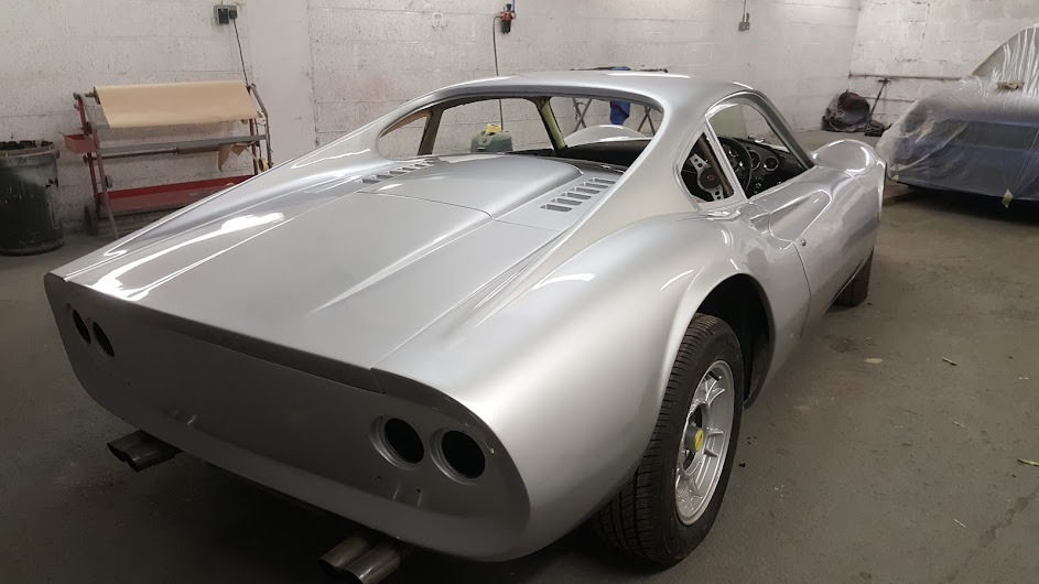 Rear view of the silver classic Dino in the bodyshop